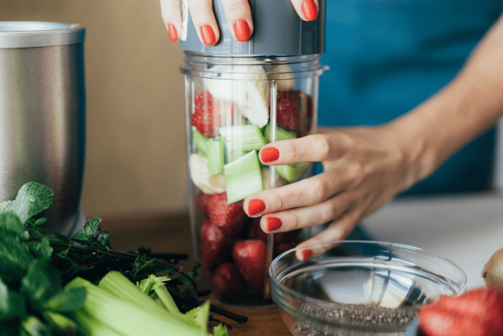 Portable Blenders-wcvendors - WC Vendors Hands blending fruits and vegetables in a portable blender at home