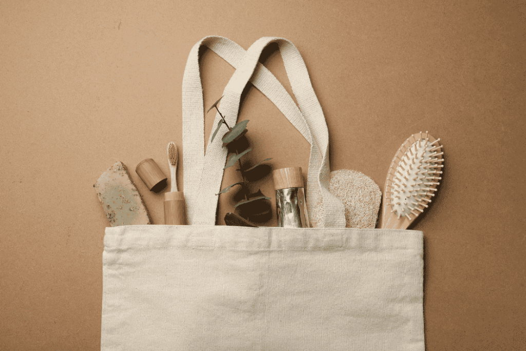 eco-friendly-products-wcvendors - WC Vendors Eco-friendly products in a reusable bag including a bamboo toothbrush, wooden brush, and zero-waste items for sustainable marketplaces.